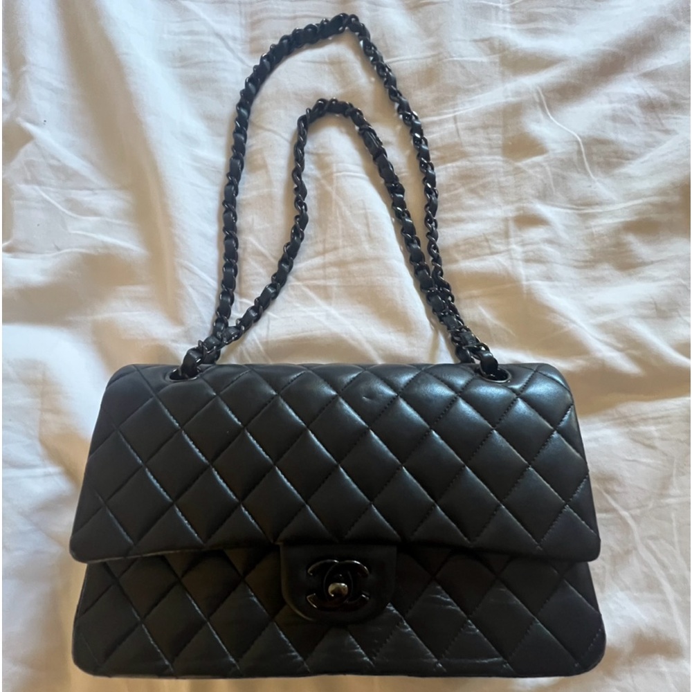 Selling my mom’s Chanel bag very rare with black chain.